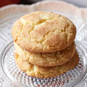 three snickerdoodles on a plate.