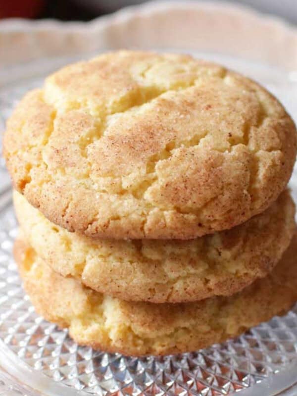 three snickerdoodles on a plate.