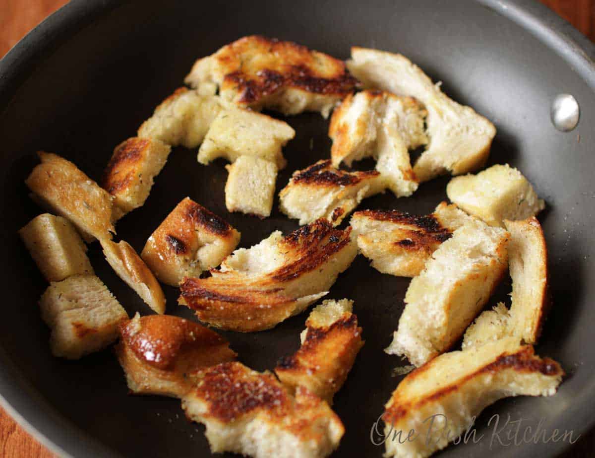 Croutons browning in a frying pan 