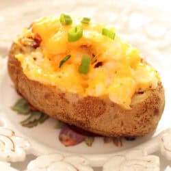 a twice baked potato on a plate.