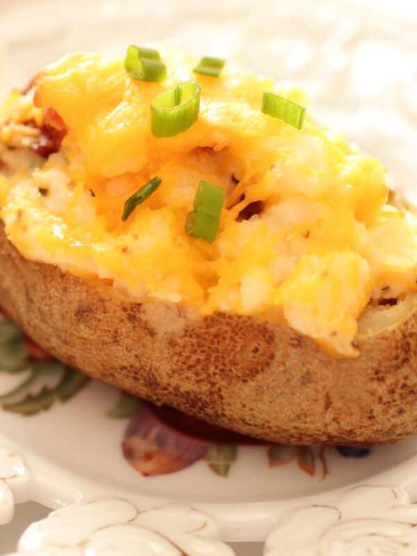 a twice baked potato on a plate.