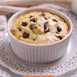 a large chocolate chip muffin in a white ramekin.