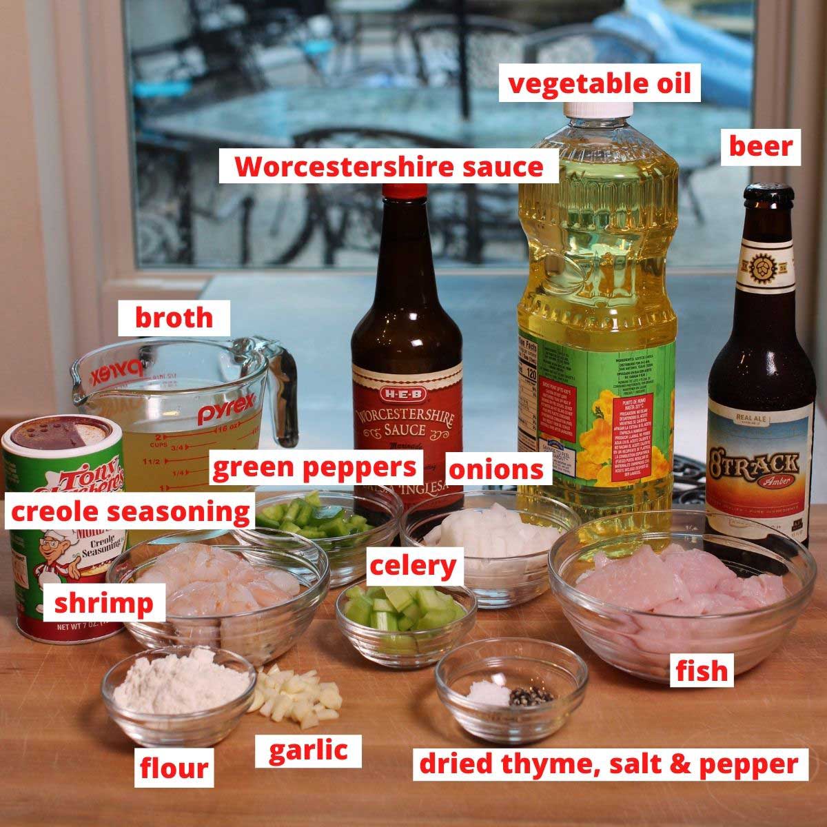 ingredients labeled for making gumbo on a brown table