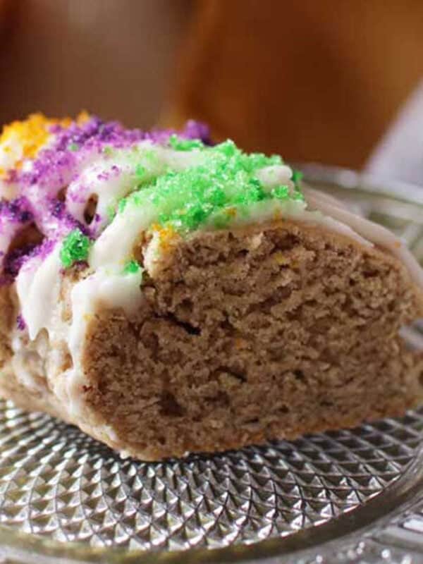 a king cake scone on a plate.