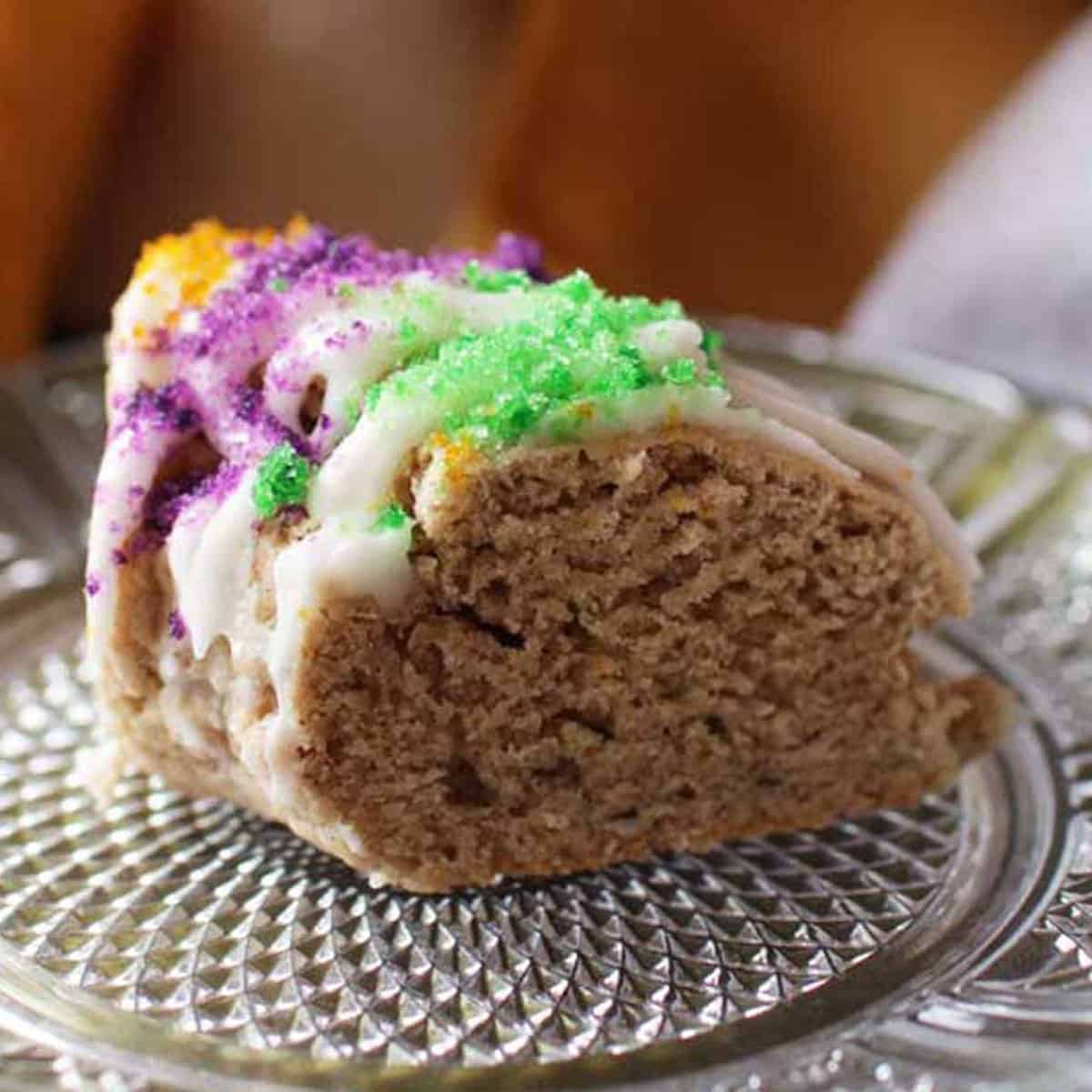 a king cake scone on a plate.