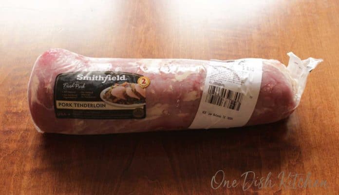a pork tenderloin wrapped in plastic.