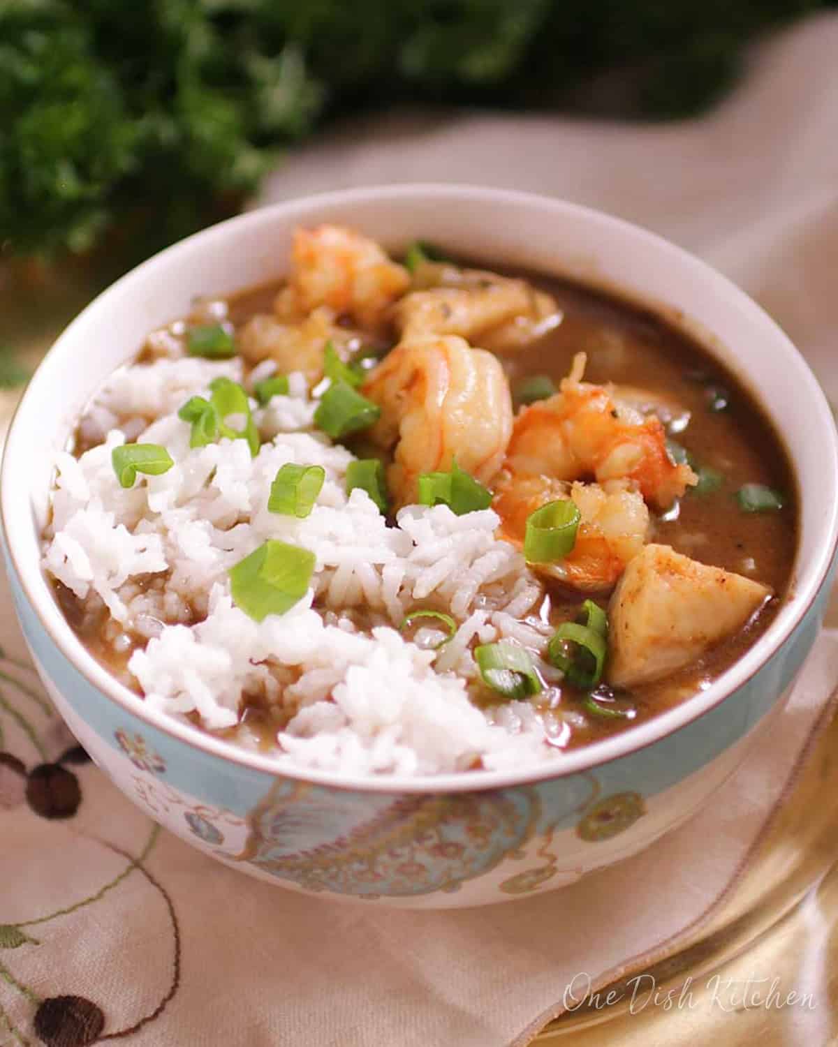 a single serving of seafood gumbo for one over white rice.