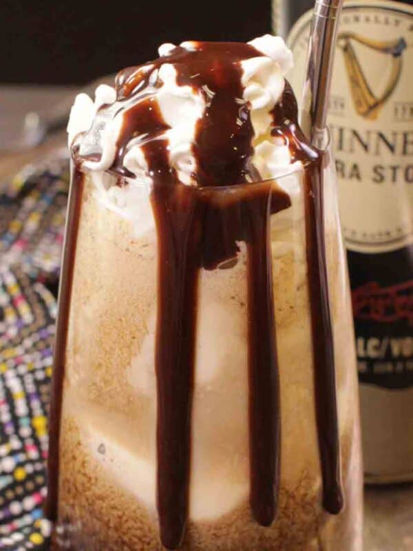a glass filled with Guinness with vanilla ice cream on top.