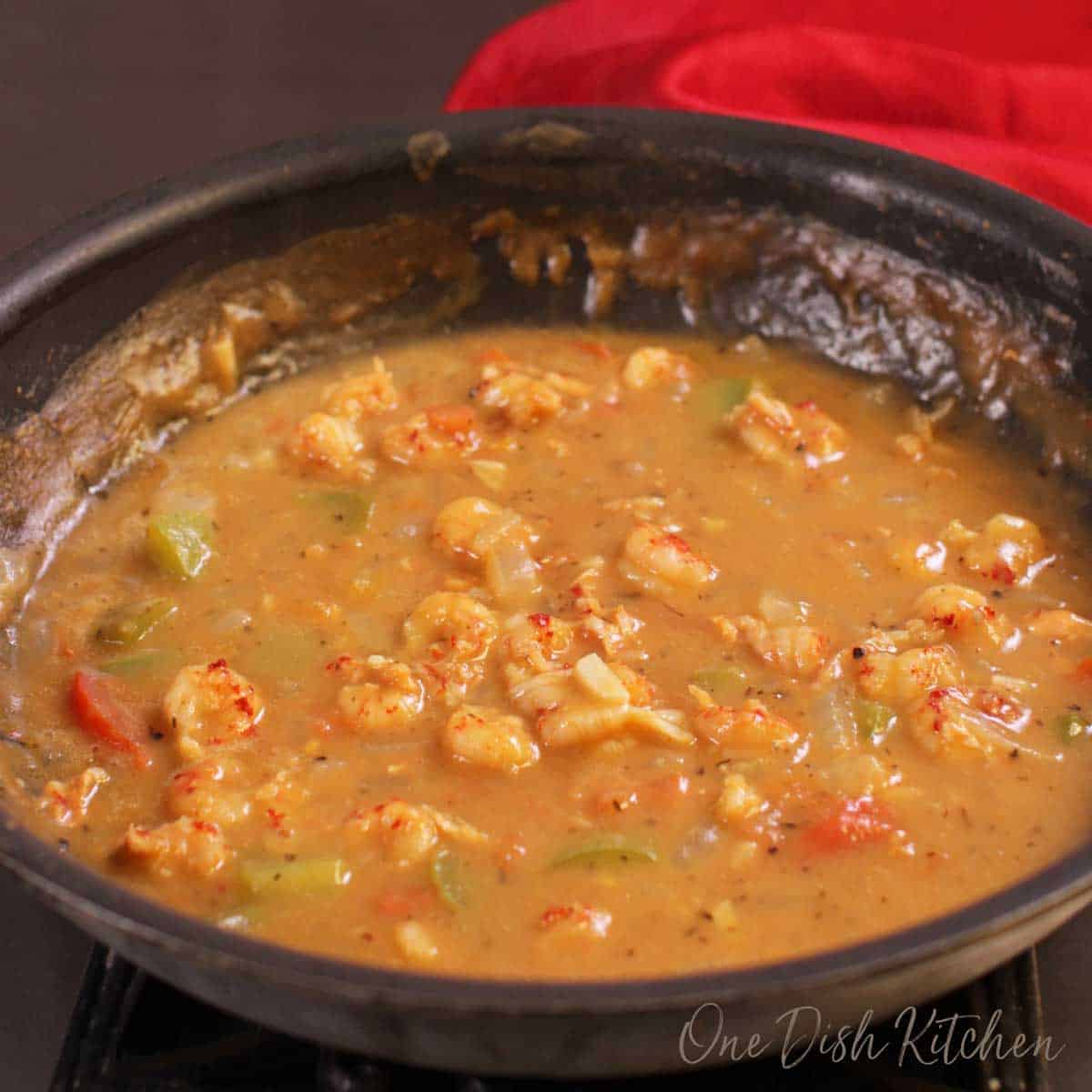 Crawfish Étouffée simmering in a skillet 