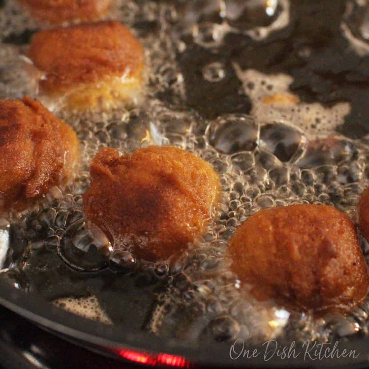 Donut holes frying in oil