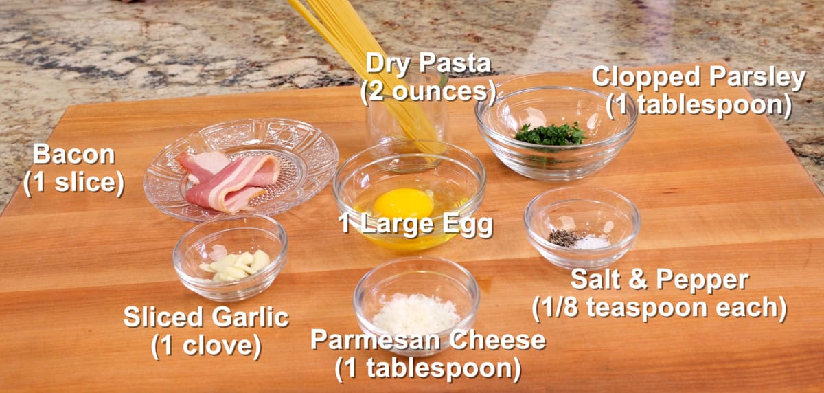 pasta carbonara ingredients on a kitchen counter.