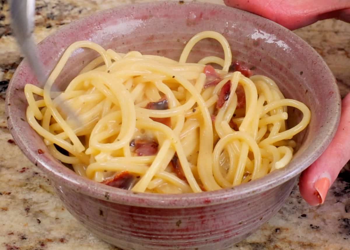 a small bowl of pasta carbonara.