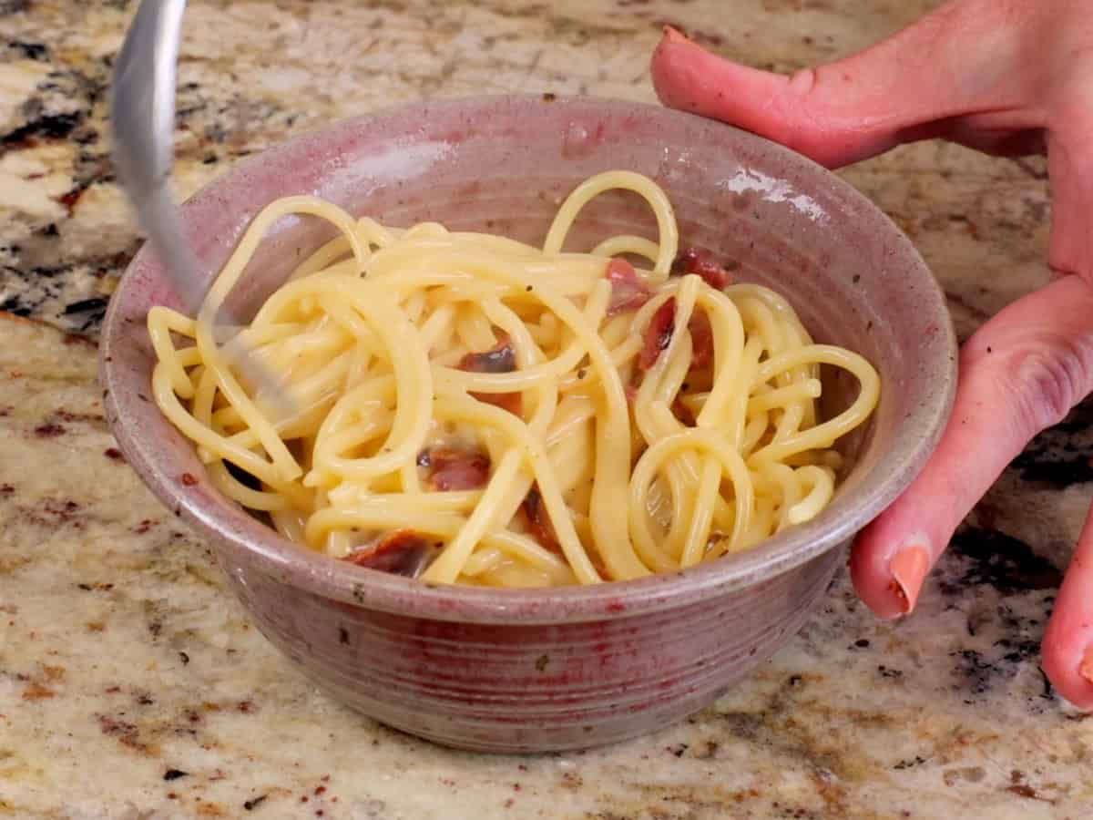 a small bowl of pasta carbonara.