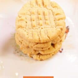 four peanut butter cookies stacked on top of each other.