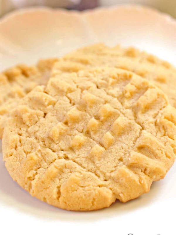 a small batch of chewy peanut butter cookies on a plate.