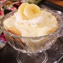a single serving of banana cream pie with homemade pudding, banana slices, and whipped cream.