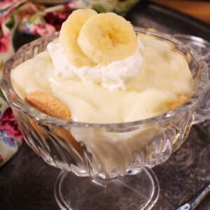 a single serving of banana cream pie with homemade pudding, banana slices, and whipped cream.