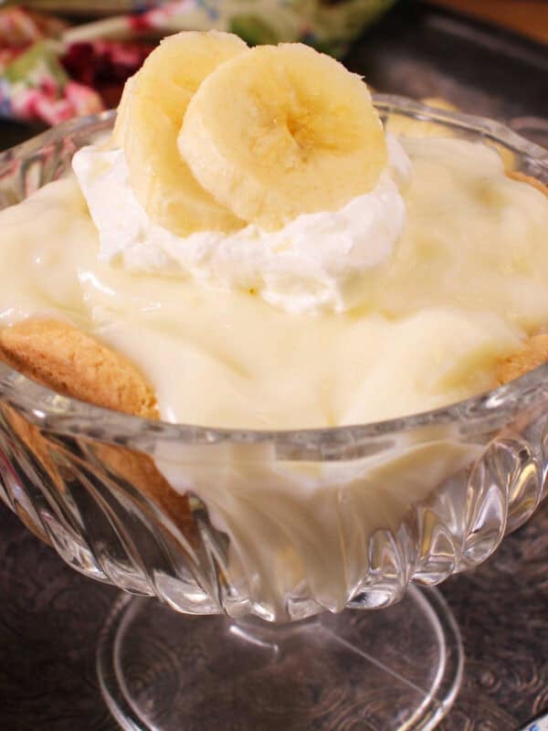 a single serving of banana cream pie with homemade pudding, banana slices, and whipped cream.