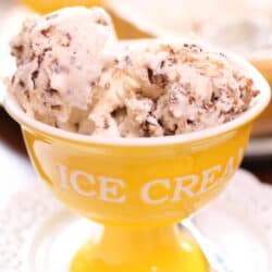 a yellow bowl filled with butter pecan ice cream.