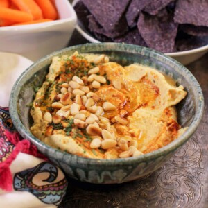 hummus in a bowl on a tray.