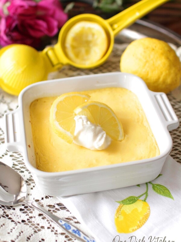 Lemon mango pie with sliced lemon and whipped cream on top