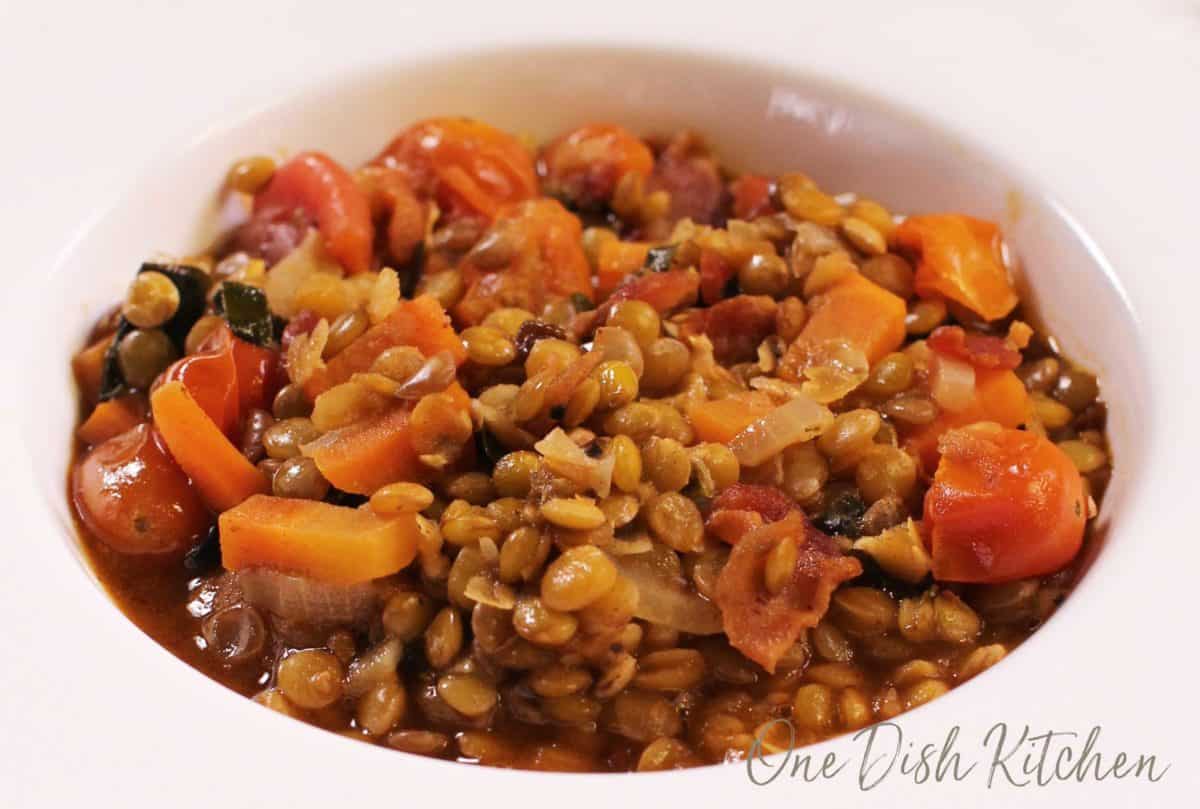 A close up of a bowl of lentil stew.