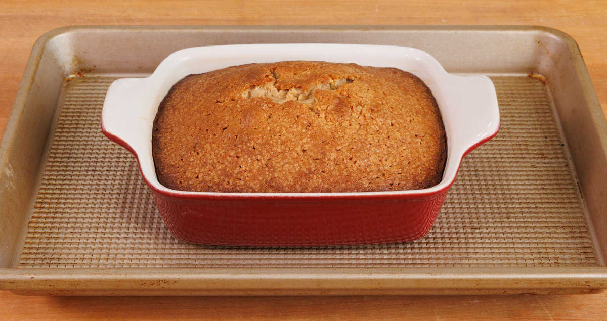 a baked mini spice cake on a baking sheet.