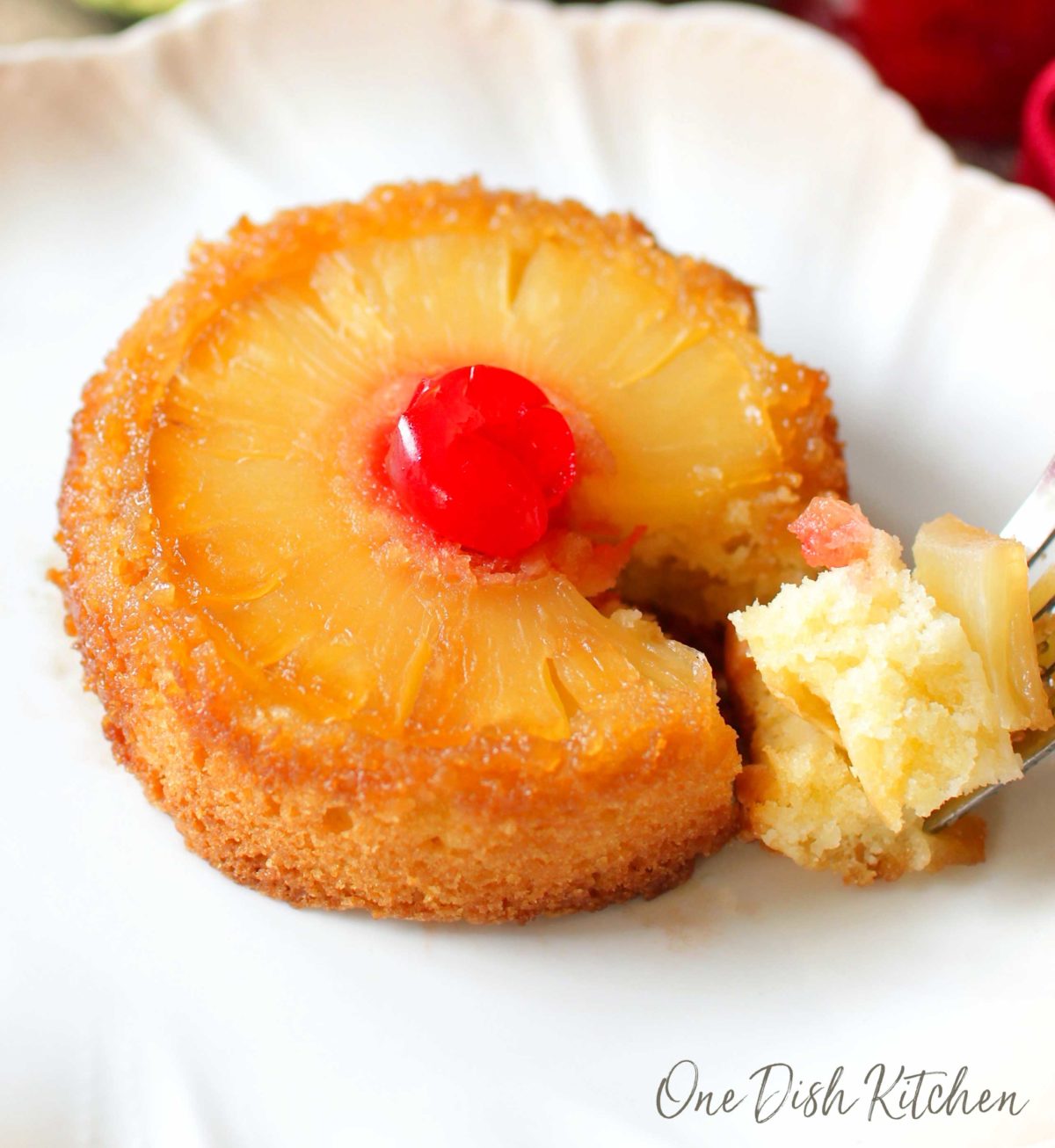 a closeup of a partially eaten pineapple upside down cake.