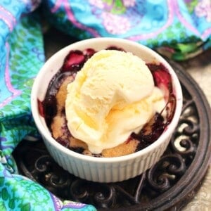a small blueberry cobbler topped with ice cream.