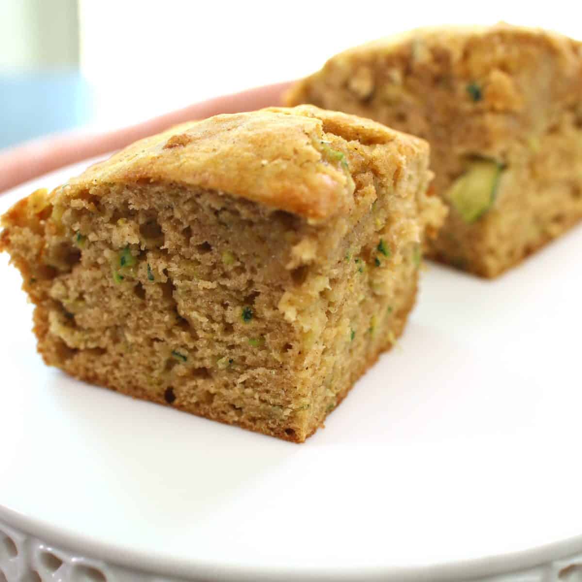 two squares of zucchini bread on a plate.