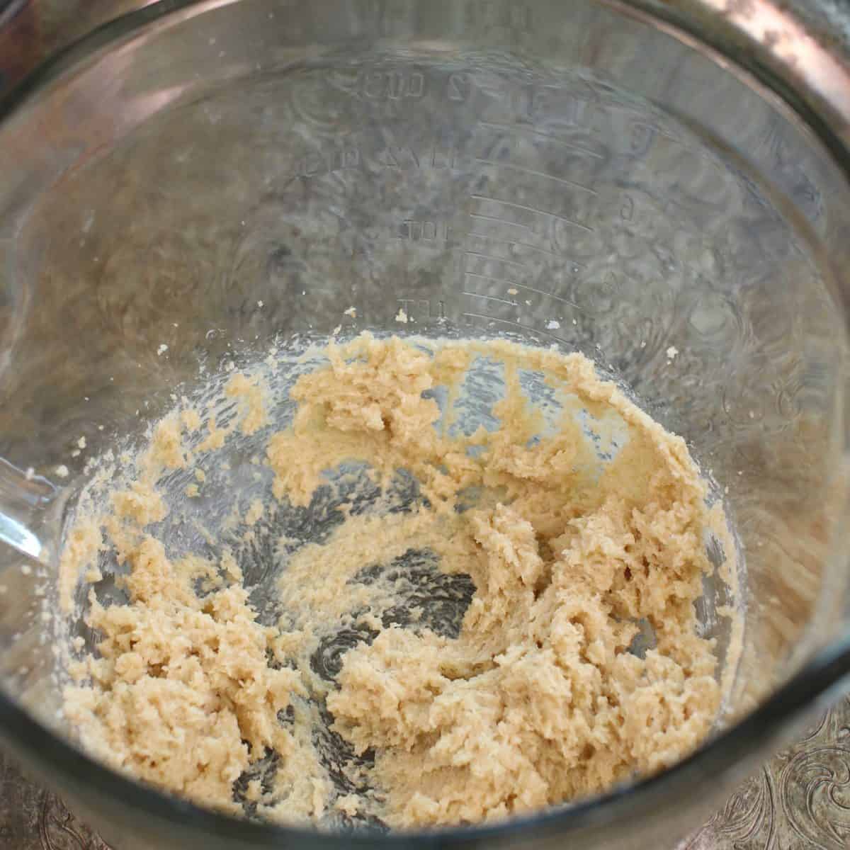 butter and sugar mixed together in a mixing bowl.