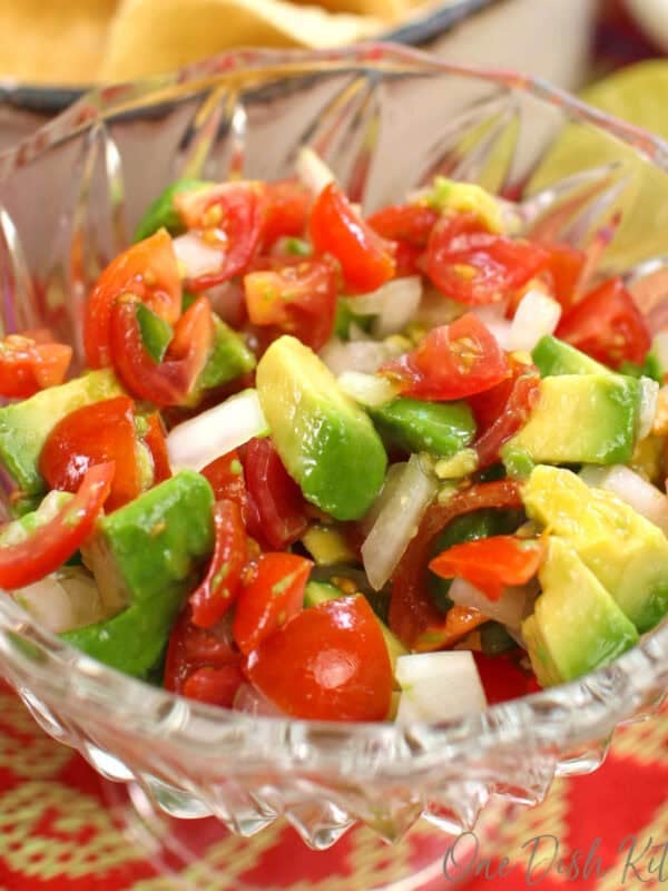 a single serving of pico de gallo with tomatoes, onions, jalapenos and lime juice in a bowl.