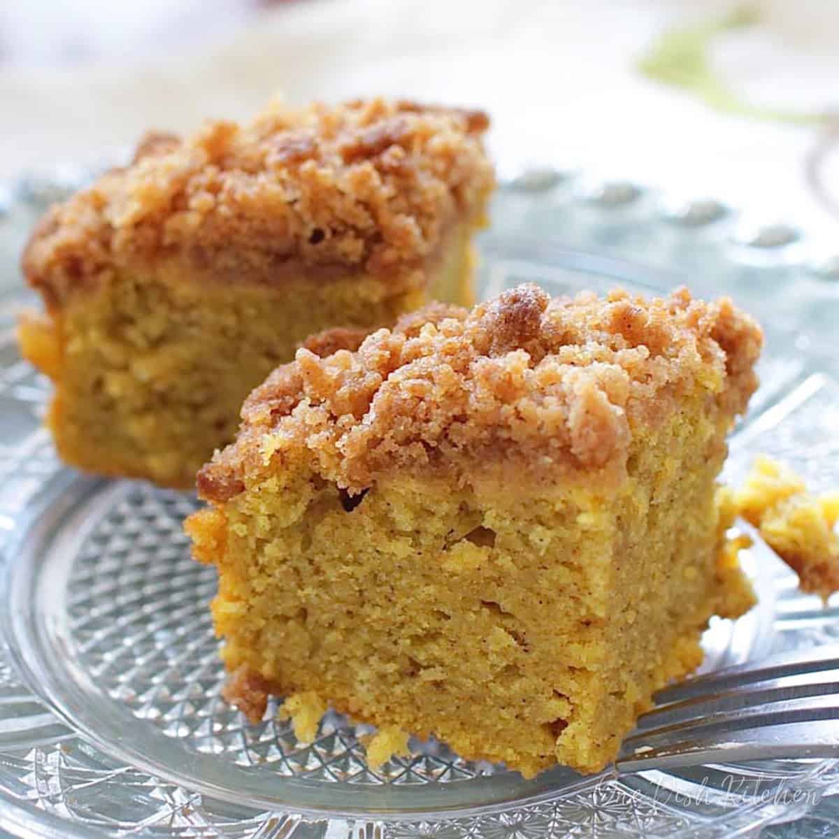 slices of pumpkin coffee cake on a white plate.