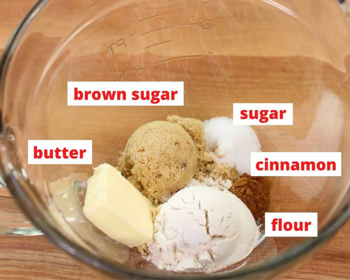 ingredients to make streusel in a bowl including flour, sugars, and butter.