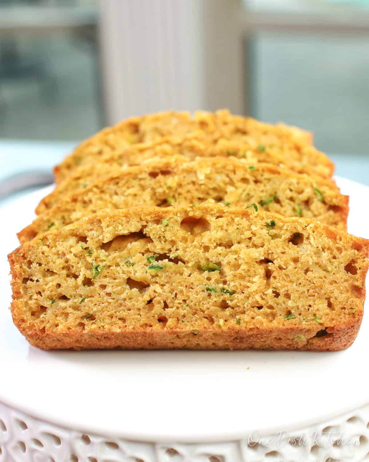 slices of zucchini bread on a white plate.