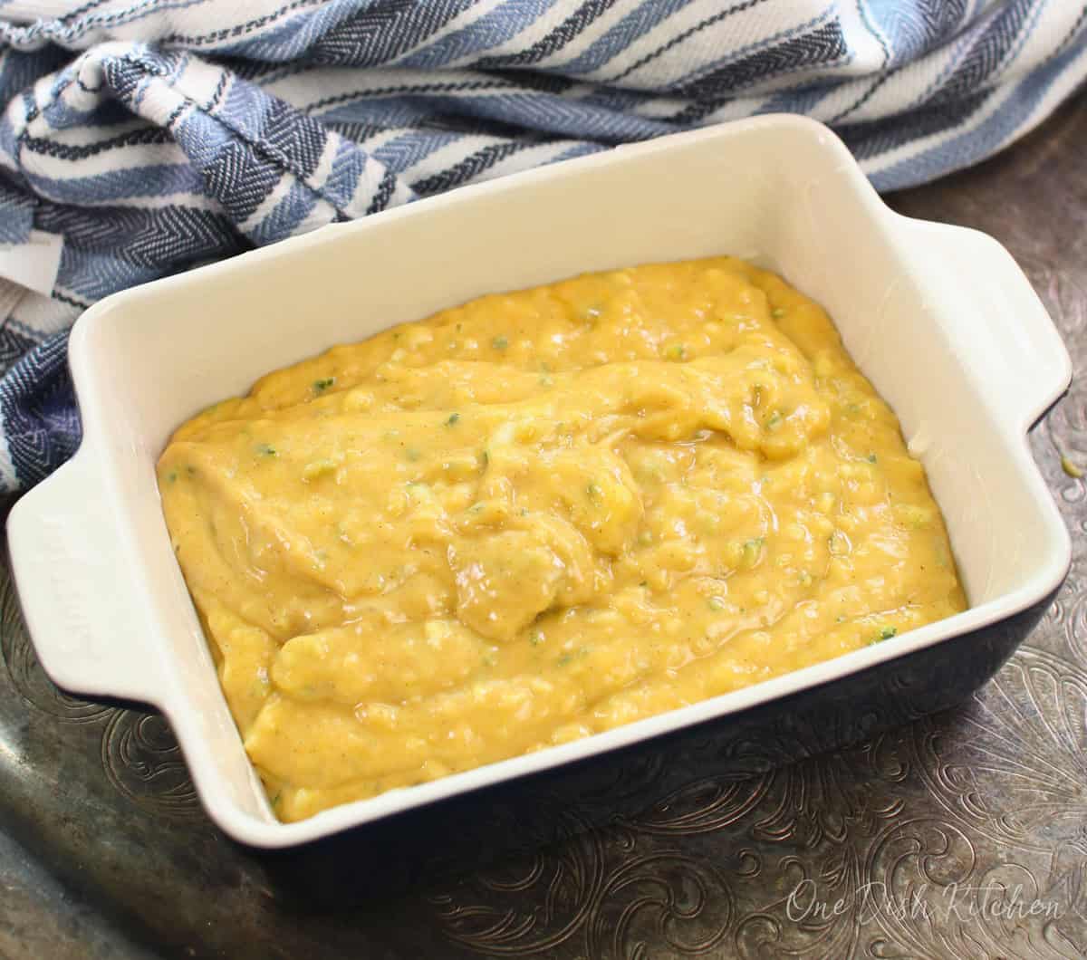 unbaked zucchini bread in a baking dish.