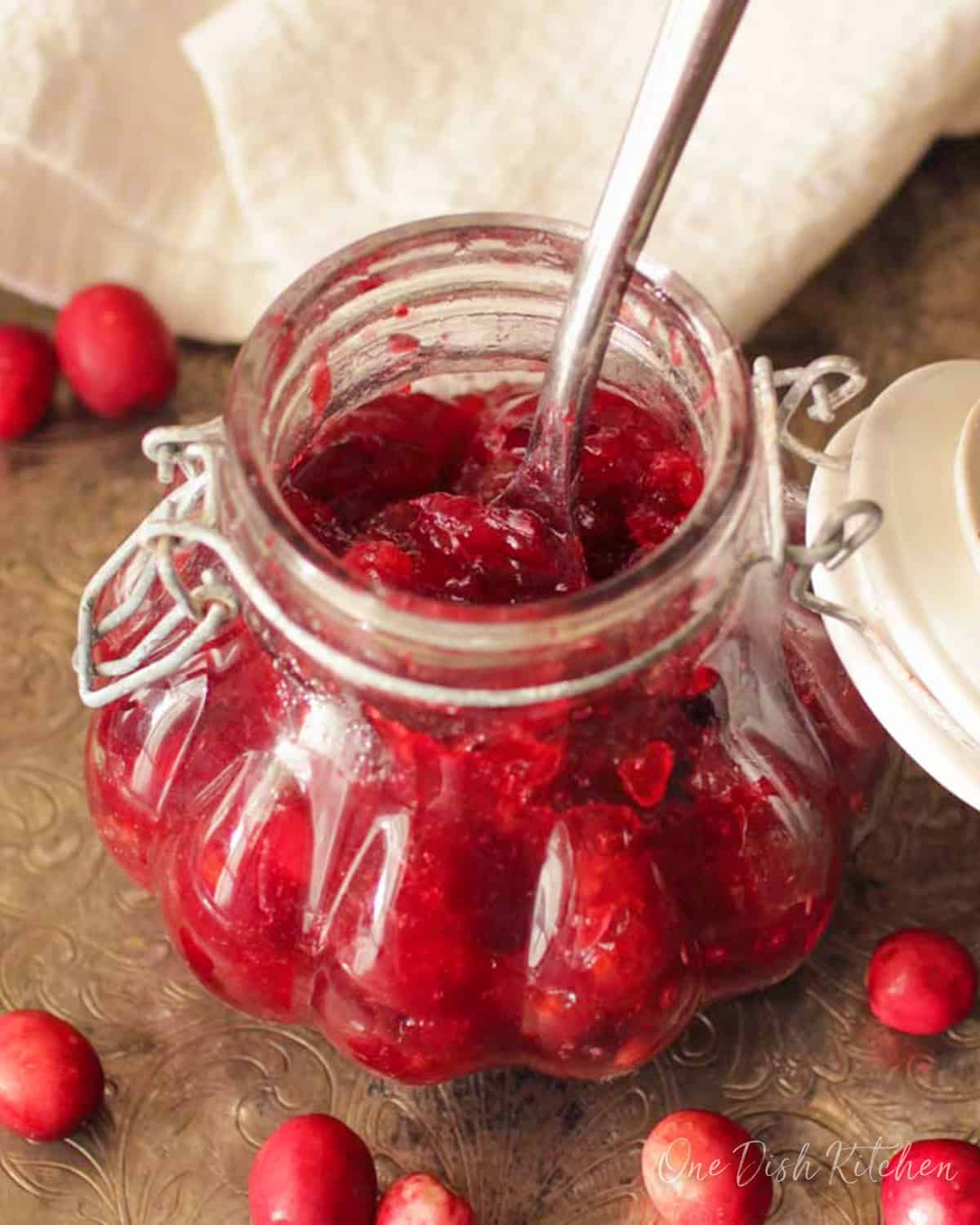 a small batch of cranberry jam without pectin in a small jar.