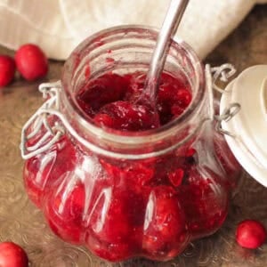 a small batch of homemade cranberry jam in a jar.