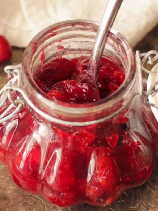 a small batch of homemade cranberry jam in a jar.
