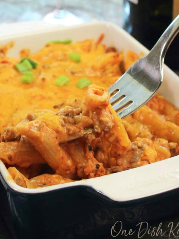 a single serving hamburger hot dish or hamburger casserole topped with cheddar cheese.