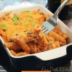 a single serve hamburger casserole with a fork on the side of the dish.