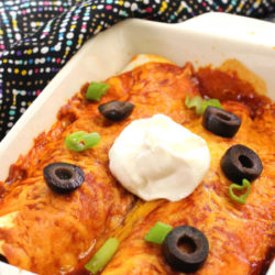 beef enchiladas topped with sour cream
