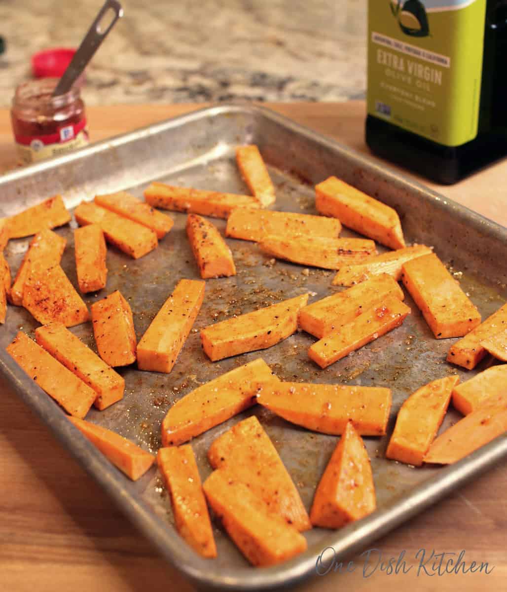 a tray of unbaked sweet potato fries.