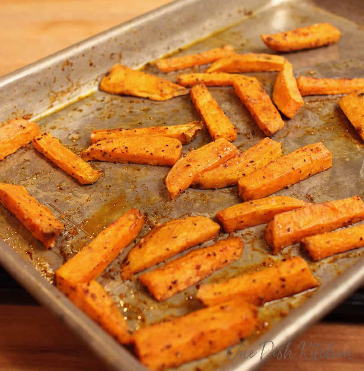 baked sweet potato fries on a baking sheet.