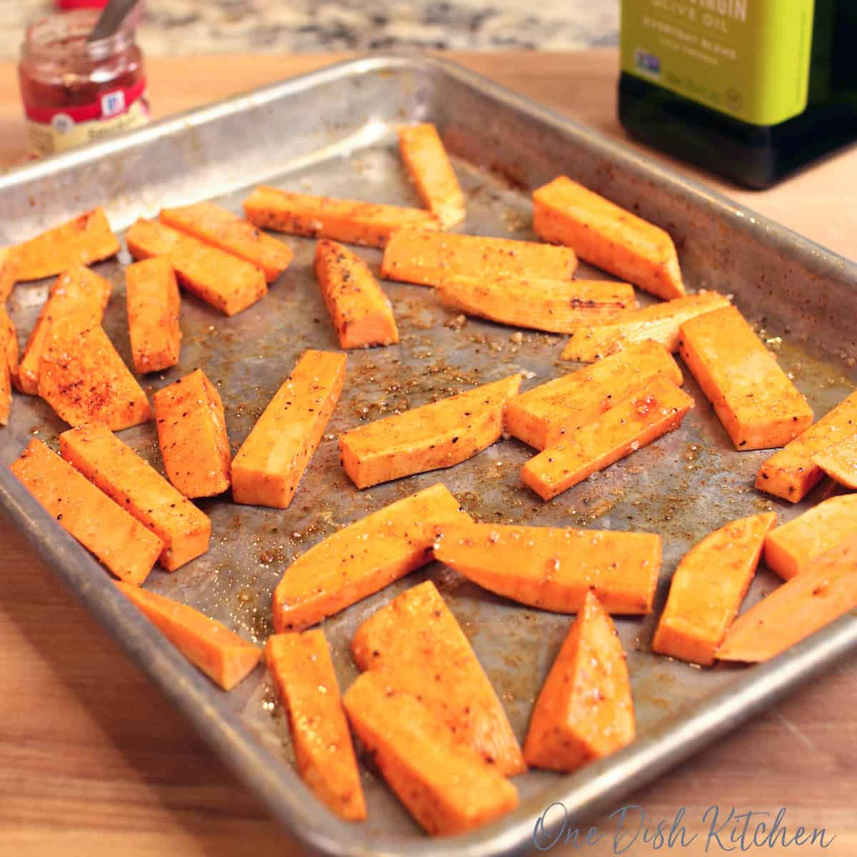 a tray of unbaked sweet potato fries.