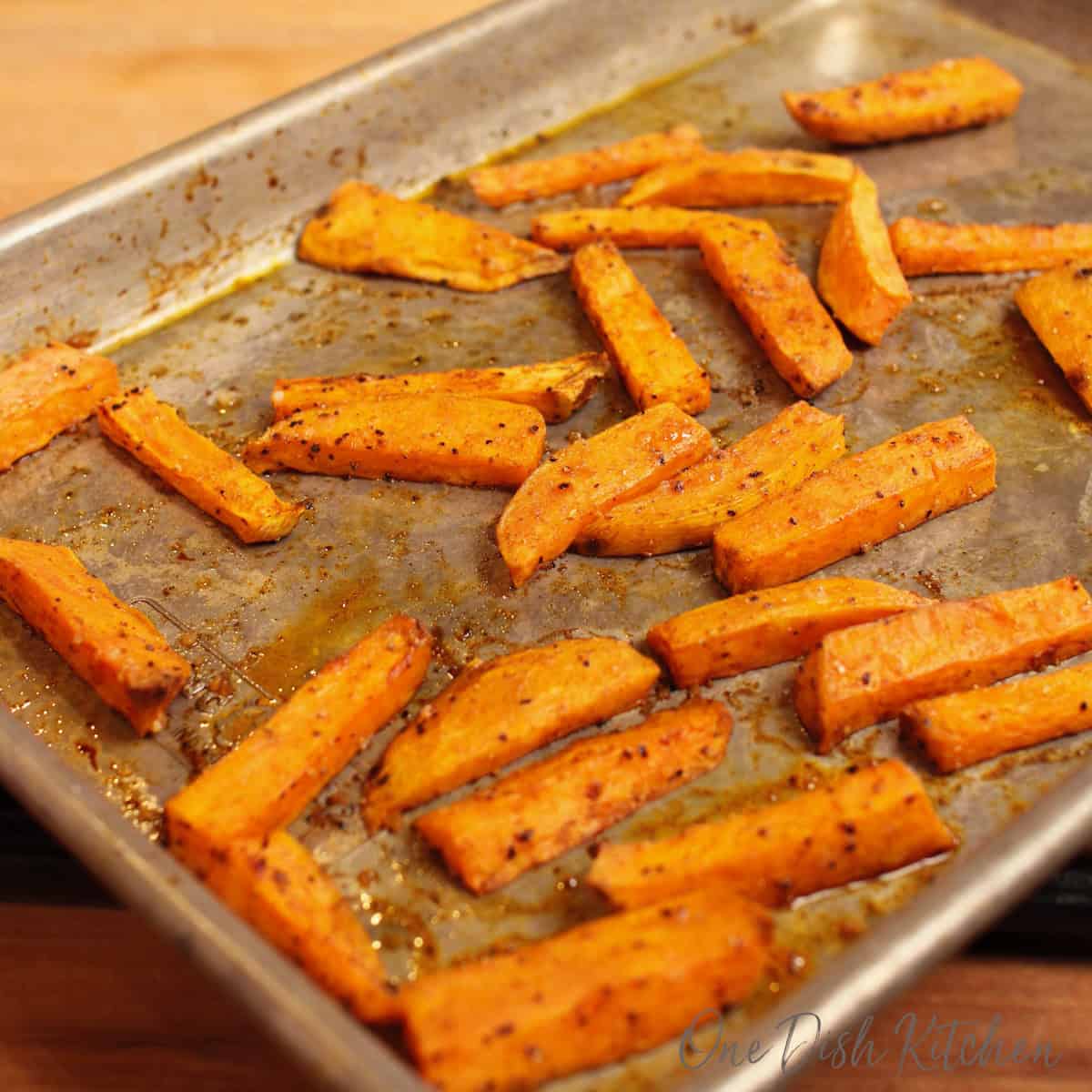 baked sweet potato fries on a baking sheet.