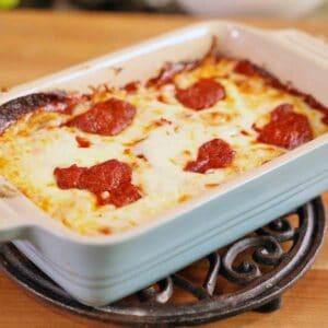 Detroit style pizza in baking dish.