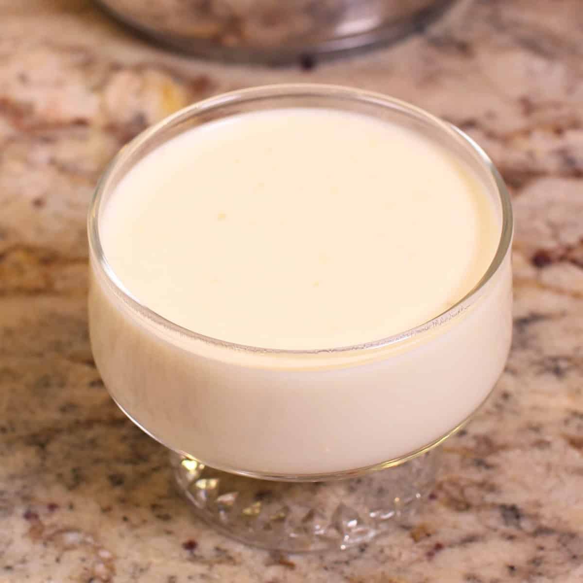 an unchilled grapefruit posset in a dessert dish.