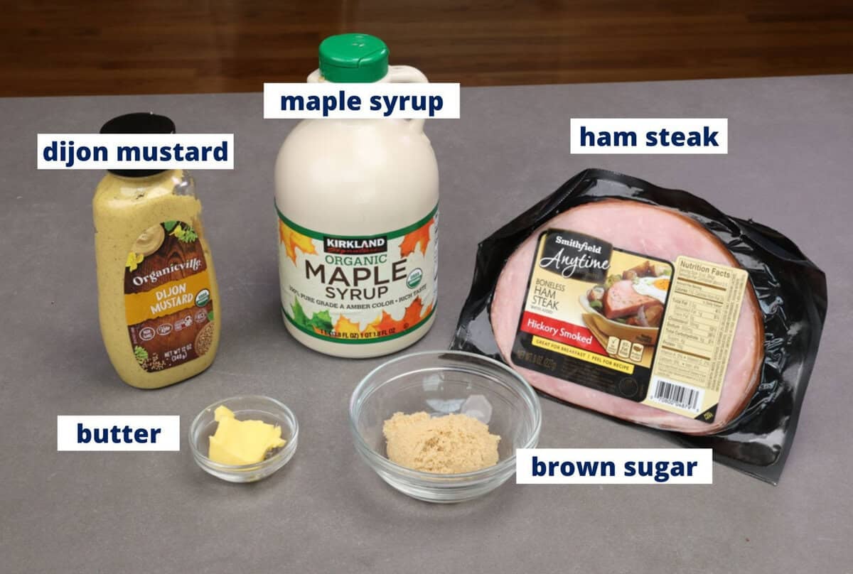 ingredients for a ham steak with glaze ingredients on a kitchen counter.
