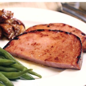 ham steak on plate with green beans